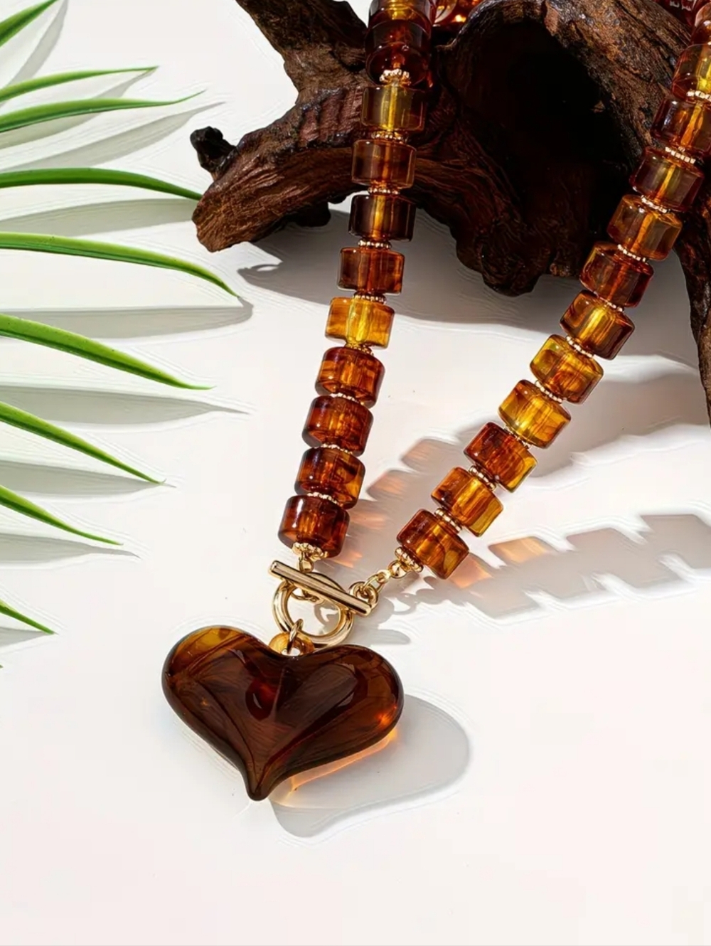 Amber colored acrylic necklace; 15.7" without the heart; nwot